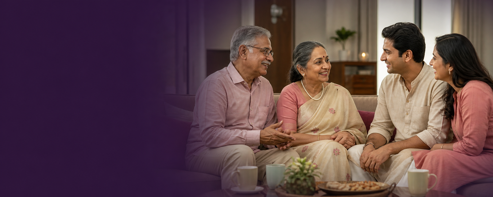 A happy Indian senior couple enjoying a family conversation at home